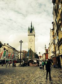 City street against cloudy sky