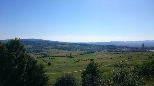Scenic view of landscape against cloudy sky