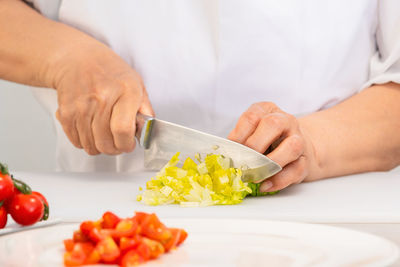 Midsection of man preparing food on table