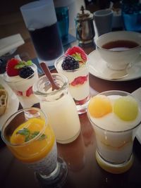 Close-up of fruits and drink on table