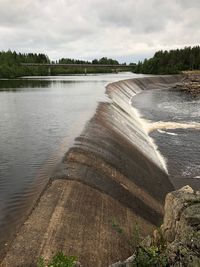 Scenic view of dam against sky