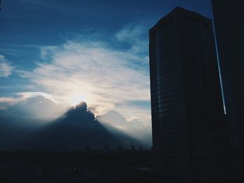 Scenic view of mountains against sky at sunset