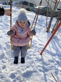 Full length of cute girl in snow