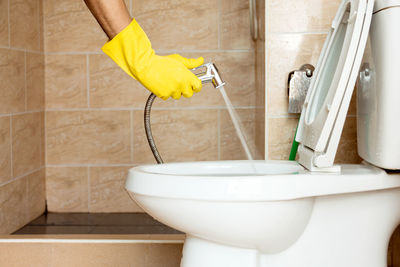 Low angle view of people in bathroom at home