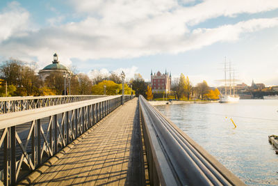 View of bridge over river in city