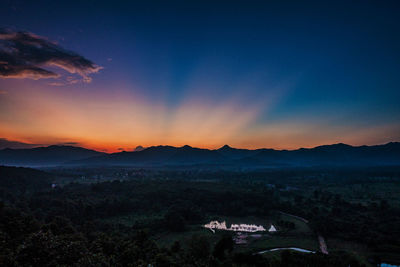 Scenic view of landscape against sky at sunset