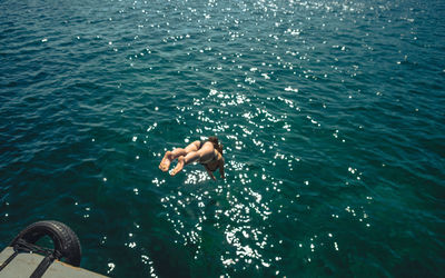 Low section of man in sea