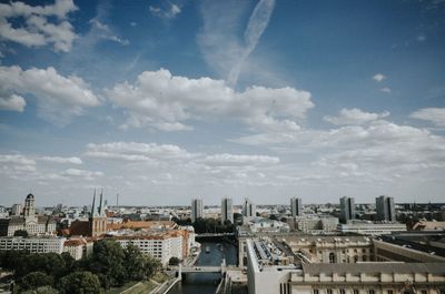 High angle view of city against cloudy sky