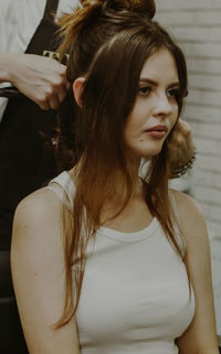 Portrait of a young girl at the hairdresser.