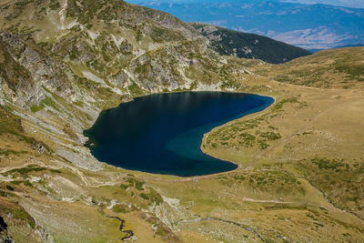 High angle view of lake amidst mountains