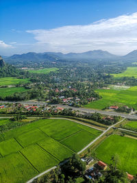 Aerial view of agricultural field against sky