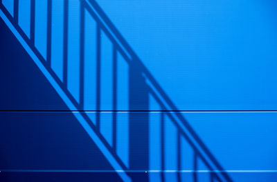 Close-up of abstract pattern against blue sky