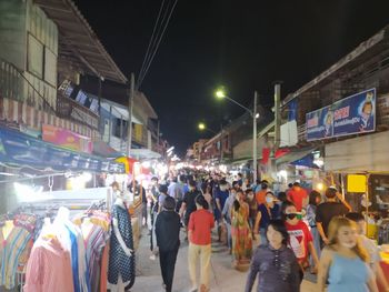 People on city street at night