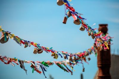 Low angle view of decoration hanging against clear sky