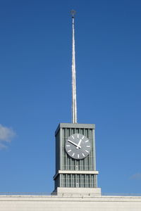 Low angle view of clock tower against sky