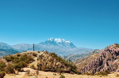 Scenic view of mountains against clear blue sky