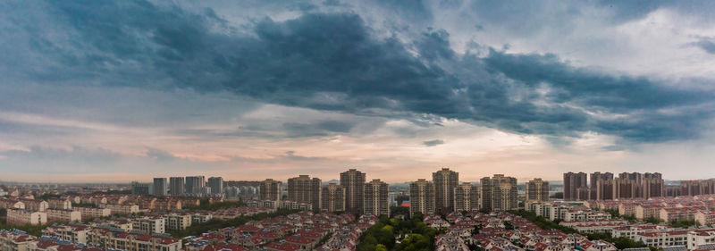 Panoramic view of cityscape against sky during sunrise
