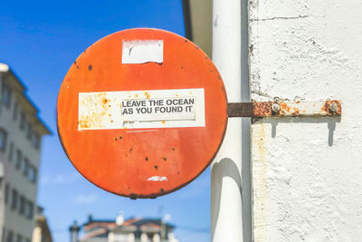 Close-up of warning sign on wall