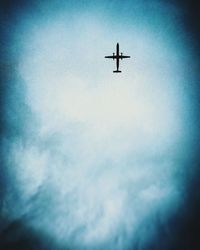 Low angle view of airplane in sky