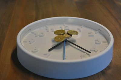 High angle view of clock on table