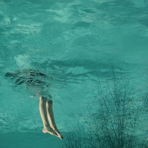 Upside down of woman in sea