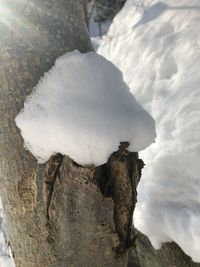 Close-up of rocks against sky during winter