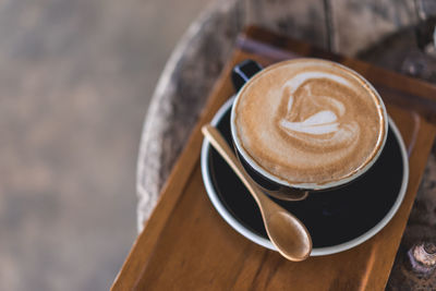 High angle view of cappuccino on table