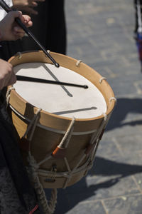 Man playing drum outdoors