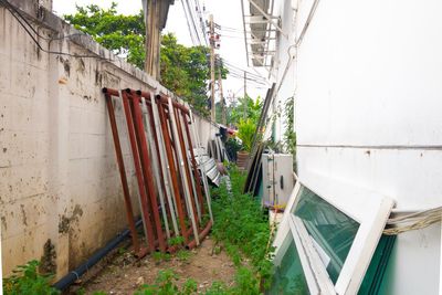 Abandoned building by wall