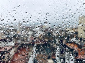 Full frame shot of raindrops on glass window