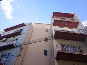 Low angle view of buildings against blue sky