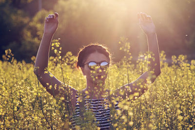 Portrait of happy girl holding flowers