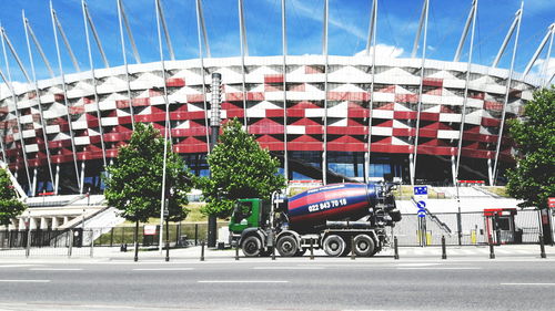 Vehicles on road against buildings in city