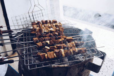 High angle view of meat on barbecue grill