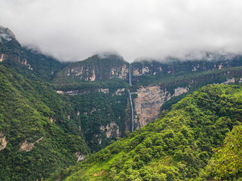 High angle view of trees and mountains against sky