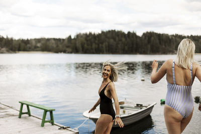 Happy women at lake