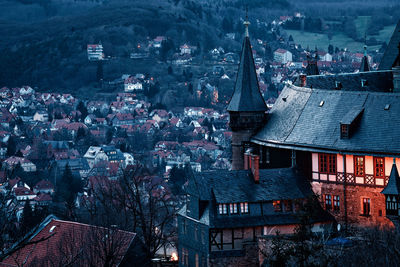 High angle view of buildings in city a night