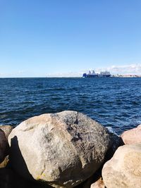 Scenic view of sea against blue sky