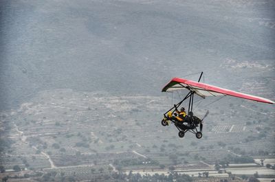 Rear view of an aircraft over landscape