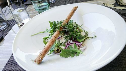 High angle view of vegetables in plate on table