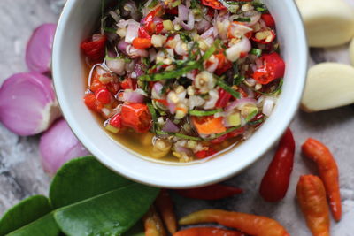 High angle view of chopped fruits in bowl on table