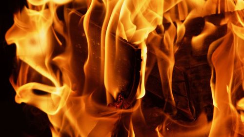 Close-up of fire burning at night