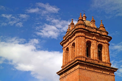 The belfry of cathedral basilica of the assumption of the virgin against sunny sky, cusco, peru