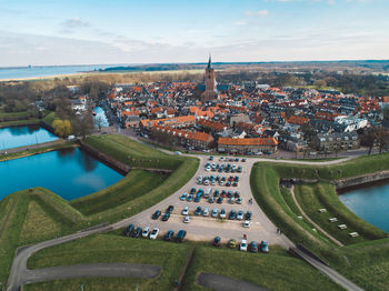 High angle view of city buildings against sky