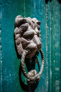 Close-up of sculpture on metal door