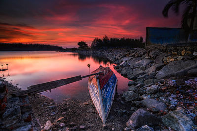 Scenic view of lake against sky during sunset