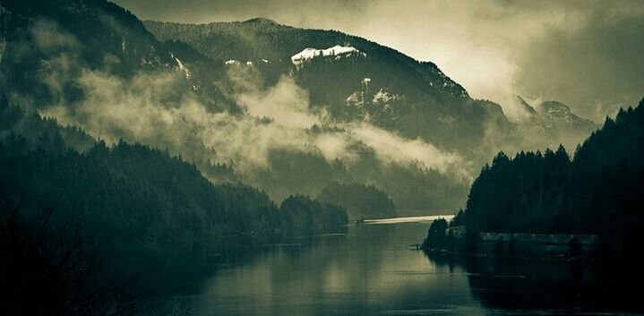 mountain, water, tranquil scene, scenics, tranquility, mountain range, beauty in nature, lake, waterfront, reflection, nature, sky, idyllic, non-urban scene, fog, majestic, river, calm, cloud - sky, remote