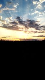 Scenic view of silhouette landscape against sky during sunset