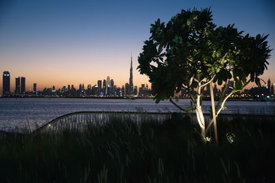 Dubai skyline from dubai creek harbour and dubai canal to downtown and business bay, uae