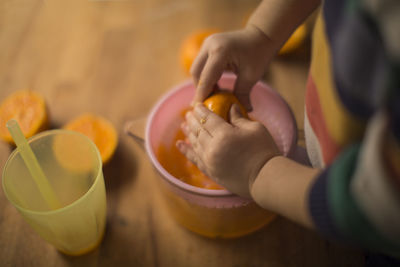 High angle view of person preparing food on table